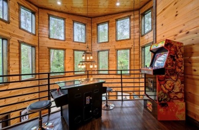 *The Howling Wolf* is a towering getaway cabin at the end of the on Cedar Creek Golf Course At Beavers Bend State Park in Oklahoma - for sale on GolfHomes.com, golf home, golf lot