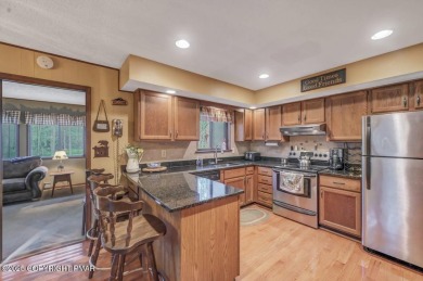 Discover the perfect blend of comfort and charm in this on Lake Naomi Timber Trails Golf Club in Pennsylvania - for sale on GolfHomes.com, golf home, golf lot