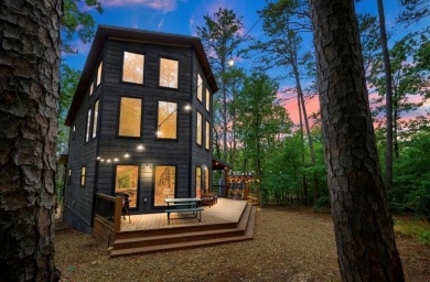 *The Howling Wolf* is a towering getaway cabin at the end of the on Cedar Creek Golf Course At Beavers Bend State Park in Oklahoma - for sale on GolfHomes.com, golf home, golf lot