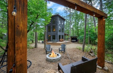 *The Howling Wolf* is a towering getaway cabin at the end of the on Cedar Creek Golf Course At Beavers Bend State Park in Oklahoma - for sale on GolfHomes.com, golf home, golf lot