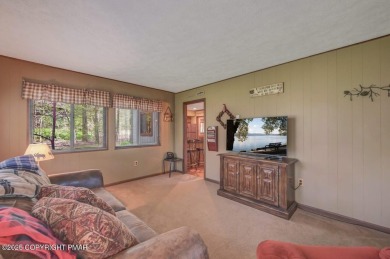 Discover the perfect blend of comfort and charm in this on Lake Naomi Timber Trails Golf Club in Pennsylvania - for sale on GolfHomes.com, golf home, golf lot