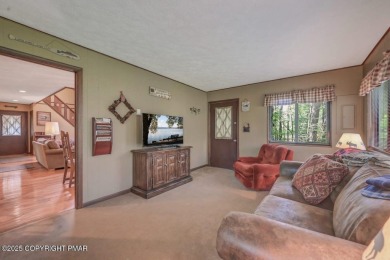 Discover the perfect blend of comfort and charm in this on Lake Naomi Timber Trails Golf Club in Pennsylvania - for sale on GolfHomes.com, golf home, golf lot