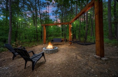 *The Howling Wolf* is a towering getaway cabin at the end of the on Cedar Creek Golf Course At Beavers Bend State Park in Oklahoma - for sale on GolfHomes.com, golf home, golf lot