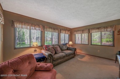 Discover the perfect blend of comfort and charm in this on Lake Naomi Timber Trails Golf Club in Pennsylvania - for sale on GolfHomes.com, golf home, golf lot