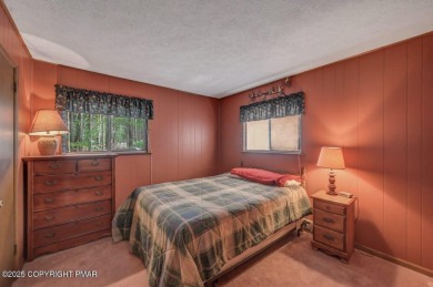 Discover the perfect blend of comfort and charm in this on Lake Naomi Timber Trails Golf Club in Pennsylvania - for sale on GolfHomes.com, golf home, golf lot