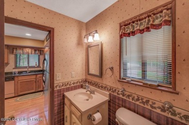 Discover the perfect blend of comfort and charm in this on Lake Naomi Timber Trails Golf Club in Pennsylvania - for sale on GolfHomes.com, golf home, golf lot