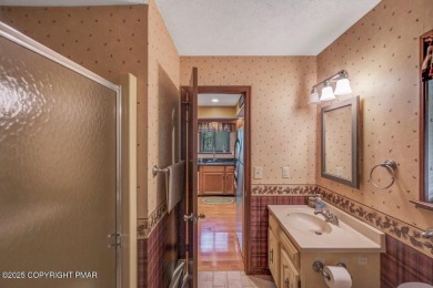Discover the perfect blend of comfort and charm in this on Lake Naomi Timber Trails Golf Club in Pennsylvania - for sale on GolfHomes.com, golf home, golf lot