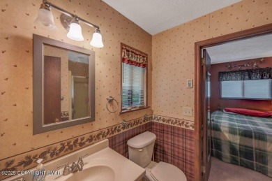Discover the perfect blend of comfort and charm in this on Lake Naomi Timber Trails Golf Club in Pennsylvania - for sale on GolfHomes.com, golf home, golf lot