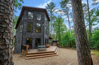 *The Howling Wolf* is a towering getaway cabin at the end of the on Cedar Creek Golf Course At Beavers Bend State Park in Oklahoma - for sale on GolfHomes.com, golf home, golf lot