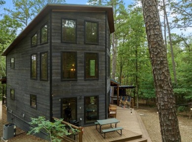 *The Howling Wolf* is a towering getaway cabin at the end of the on Cedar Creek Golf Course At Beavers Bend State Park in Oklahoma - for sale on GolfHomes.com, golf home, golf lot