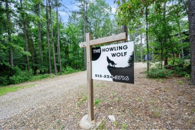 *The Howling Wolf* is a towering getaway cabin at the end of the on Cedar Creek Golf Course At Beavers Bend State Park in Oklahoma - for sale on GolfHomes.com, golf home, golf lot