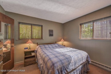 Discover the perfect blend of comfort and charm in this on Lake Naomi Timber Trails Golf Club in Pennsylvania - for sale on GolfHomes.com, golf home, golf lot