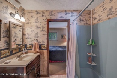 Discover the perfect blend of comfort and charm in this on Lake Naomi Timber Trails Golf Club in Pennsylvania - for sale on GolfHomes.com, golf home, golf lot