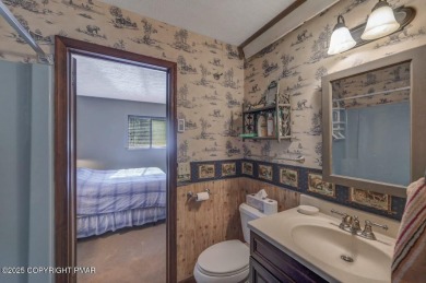 Discover the perfect blend of comfort and charm in this on Lake Naomi Timber Trails Golf Club in Pennsylvania - for sale on GolfHomes.com, golf home, golf lot