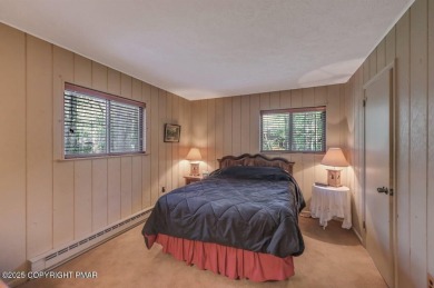 Discover the perfect blend of comfort and charm in this on Lake Naomi Timber Trails Golf Club in Pennsylvania - for sale on GolfHomes.com, golf home, golf lot