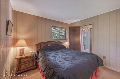 Discover the perfect blend of comfort and charm in this on Lake Naomi Timber Trails Golf Club in Pennsylvania - for sale on GolfHomes.com, golf home, golf lot