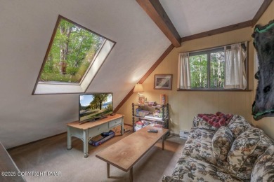 Discover the perfect blend of comfort and charm in this on Lake Naomi Timber Trails Golf Club in Pennsylvania - for sale on GolfHomes.com, golf home, golf lot