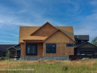 Welcome to 299 Bald Eagle Drive! This new construction home is a on Teton Reserve in Idaho - for sale on GolfHomes.com, golf home, golf lot