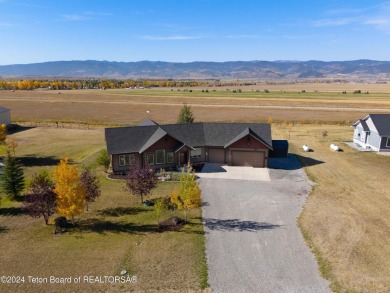 This exceptional 5-bedroom, 3-bath home, built by the renowned on Star Valley RV Golf Course in Wyoming - for sale on GolfHomes.com, golf home, golf lot