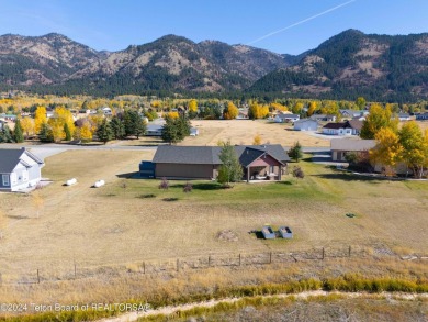 This exceptional 5-bedroom, 3-bath home, built by the renowned on Star Valley RV Golf Course in Wyoming - for sale on GolfHomes.com, golf home, golf lot