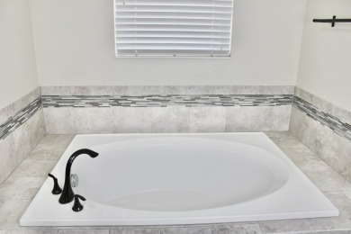 MANY UPGRADES!! Welcome to this exclusive gated community of on The Oasis Club at Champions Gate in Florida - for sale on GolfHomes.com, golf home, golf lot