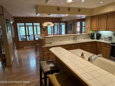 A must-see spacious home nestled in the gated Timber Trails on Lake Naomi Timber Trails Golf Club in Pennsylvania - for sale on GolfHomes.com, golf home, golf lot