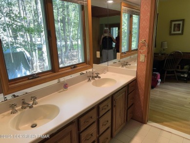 A must-see spacious home nestled in the gated Timber Trails on Lake Naomi Timber Trails Golf Club in Pennsylvania - for sale on GolfHomes.com, golf home, golf lot