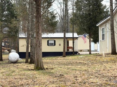 The perfect Rough River Lake property offering space on Rough River Dam State Resort Park Golf Course in Kentucky - for sale on GolfHomes.com, golf home, golf lot