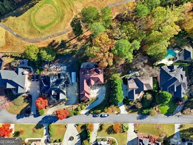 Experience luxury living at its finest with this stunning on Collins Hill Golf Club in Georgia - for sale on GolfHomes.com, golf home, golf lot