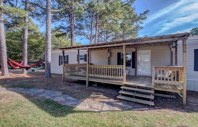 Sitting on three lots.  This Immaculate 3-bedroom, 2-bath home on Mountain Ranch Golf Club in Arkansas - for sale on GolfHomes.com, golf home, golf lot