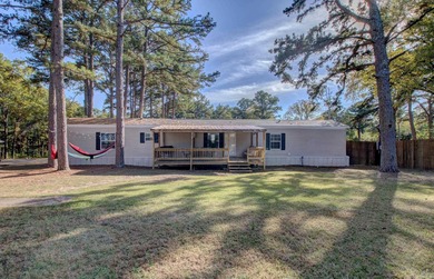 Sitting on three lots.  This Immaculate 3-bedroom, 2-bath home on Mountain Ranch Golf Club in Arkansas - for sale on GolfHomes.com, golf home, golf lot