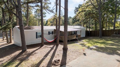 Sitting on three lots.  This Immaculate 3-bedroom, 2-bath home on Mountain Ranch Golf Club in Arkansas - for sale on GolfHomes.com, golf home, golf lot