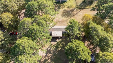 Sitting on three lots.  This Immaculate 3-bedroom, 2-bath home on Mountain Ranch Golf Club in Arkansas - for sale on GolfHomes.com, golf home, golf lot