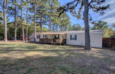 Sitting on three lots.  This Immaculate 3-bedroom, 2-bath home on Mountain Ranch Golf Club in Arkansas - for sale on GolfHomes.com, golf home, golf lot
