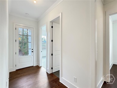 Discover easy coastal living in The Dover Bluff, a bright and on The Golf Club At Sanctuary Cove in Georgia - for sale on GolfHomes.com, golf home, golf lot