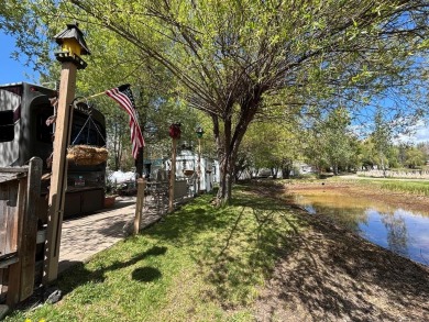 ENJOY AND RELAX!  Shade trees, pavers, flower garden, sprinkler on Cascade Golf Course in Idaho - for sale on GolfHomes.com, golf home, golf lot