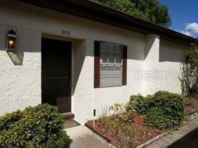 Carefree Florida living in Palm Harbor.  A small investment in on Highland Lakes Executive Golf Course in Florida - for sale on GolfHomes.com, golf home, golf lot