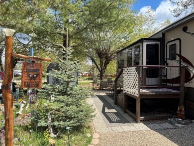 ENJOY AND RELAX!  Shade trees, pavers, flower garden, sprinkler on Cascade Golf Course in Idaho - for sale on GolfHomes.com, golf home, golf lot