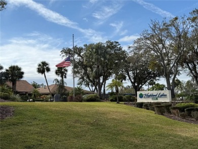 Carefree Florida living in Palm Harbor.  A small investment in on Highland Lakes Executive Golf Course in Florida - for sale on GolfHomes.com, golf home, golf lot