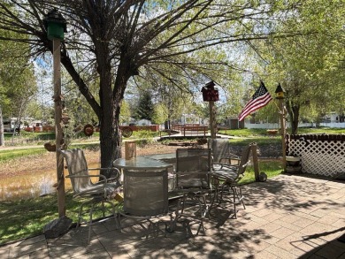 ENJOY AND RELAX!  Shade trees, pavers, flower garden, sprinkler on Cascade Golf Course in Idaho - for sale on GolfHomes.com, golf home, golf lot