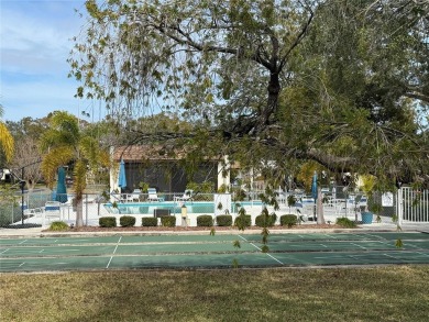 Carefree Florida living in Palm Harbor.  A small investment in on Highland Lakes Executive Golf Course in Florida - for sale on GolfHomes.com, golf home, golf lot