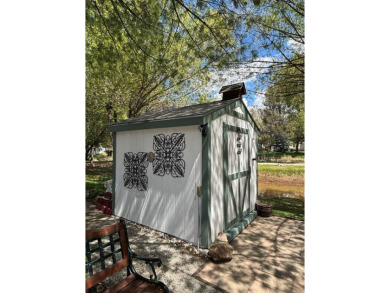 ENJOY AND RELAX!  Shade trees, pavers, flower garden, sprinkler on Cascade Golf Course in Idaho - for sale on GolfHomes.com, golf home, golf lot