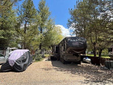 ENJOY AND RELAX!  Shade trees, pavers, flower garden, sprinkler on Cascade Golf Course in Idaho - for sale on GolfHomes.com, golf home, golf lot