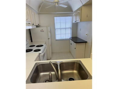 Carefree Florida living in Palm Harbor.  A small investment in on Highland Lakes Executive Golf Course in Florida - for sale on GolfHomes.com, golf home, golf lot