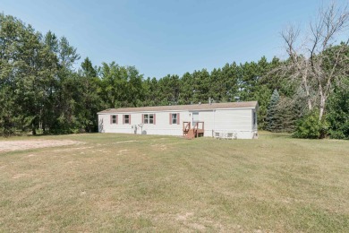 Discover a charming retreat nestled on 2.83 acres of serene on Sand Valley Golf Course in Wisconsin - for sale on GolfHomes.com, golf home, golf lot