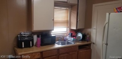 Great Starter Home or Attention Investors, Immediate Potential on The Links At Crystal Lake in Michigan - for sale on GolfHomes.com, golf home, golf lot