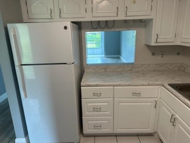 55+ COMMUNITY.UNFURNISHED, BEST LOCATION, FIRST FLOOR CORNER on Marina Lakes Golf Course in Florida - for sale on GolfHomes.com, golf home, golf lot