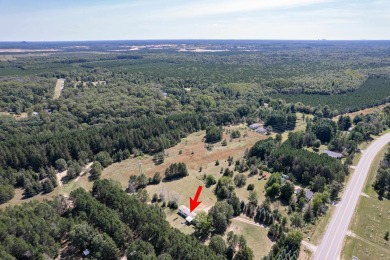 Discover a charming retreat nestled on 2.83 acres of serene on Sand Valley Golf Course in Wisconsin - for sale on GolfHomes.com, golf home, golf lot