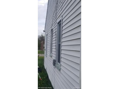 Great Starter Home or Attention Investors, Immediate Potential on The Links At Crystal Lake in Michigan - for sale on GolfHomes.com, golf home, golf lot