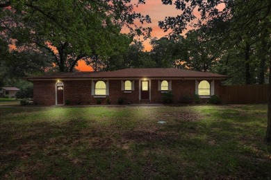 Welcome to your serene retreat in the gated community of on Hide-A-Way Lake Golf Course in Texas - for sale on GolfHomes.com, golf home, golf lot
